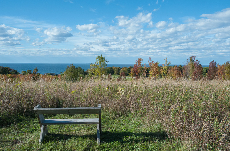 Bench at the bluff overlook with panoramic view of Green Bay